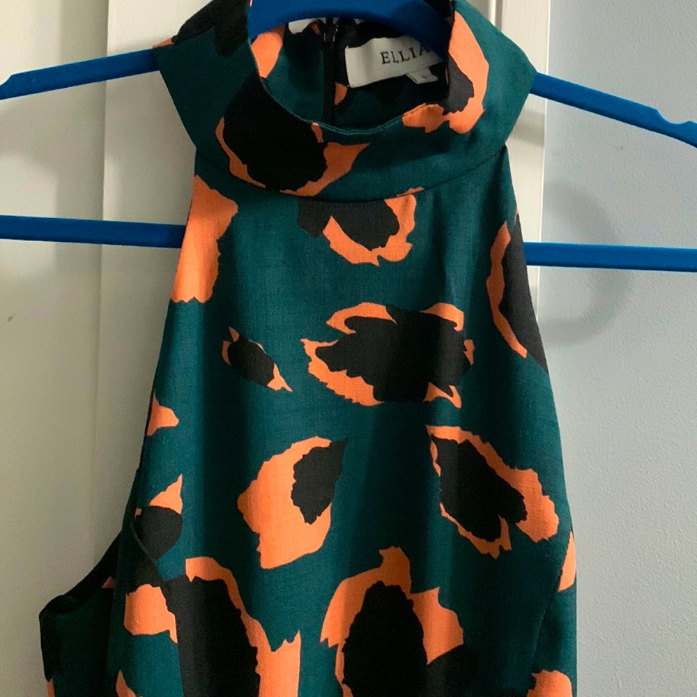 Stunning high neck sleeveless a line dress.